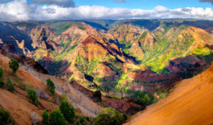 Kauai Vacations An image of Waimea Canyon, a must-see on Kauai vacations.