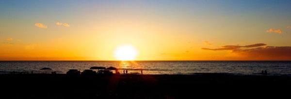 Watch the sun sink into the ocean at Polihale Beach